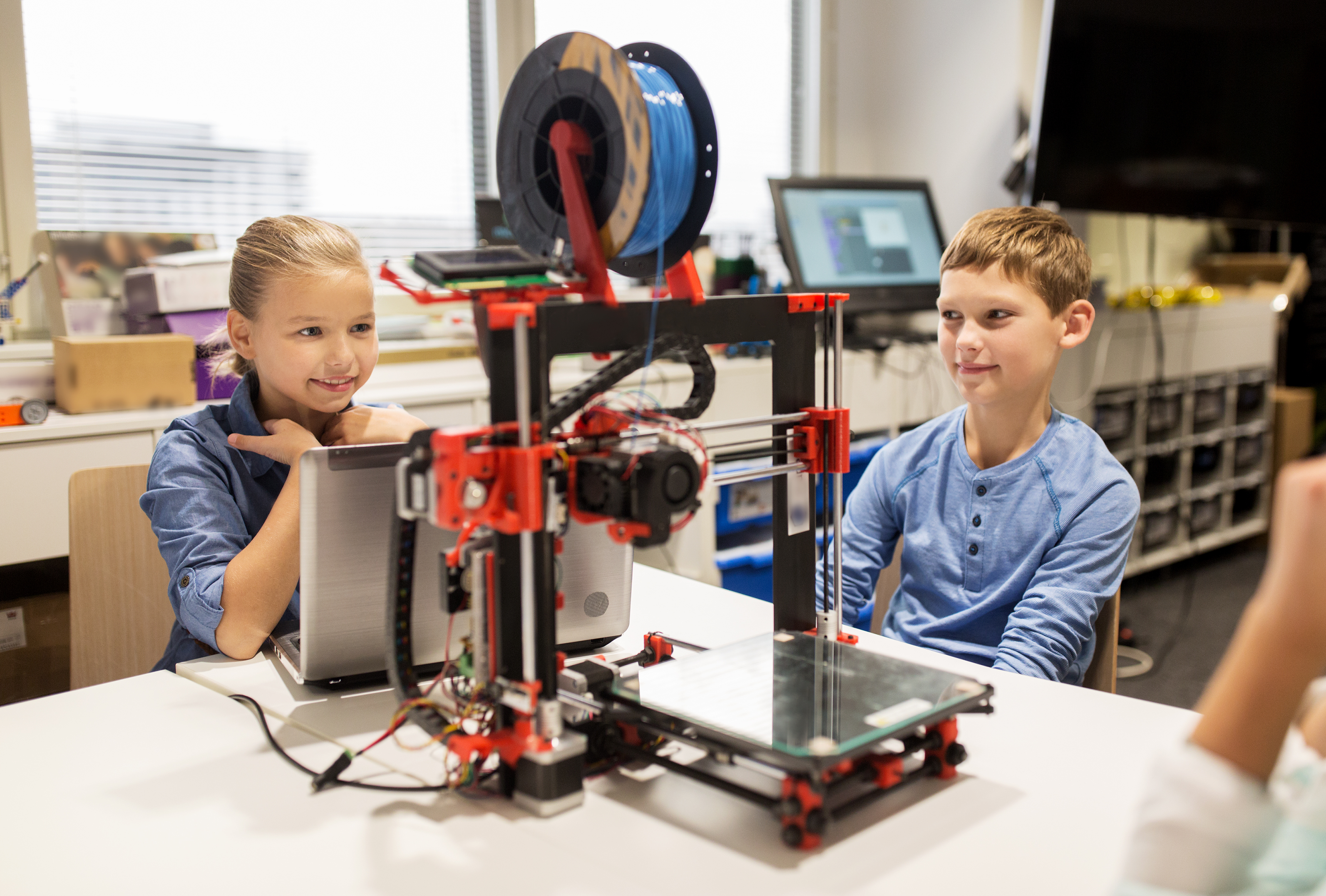 Students using a 3D printer